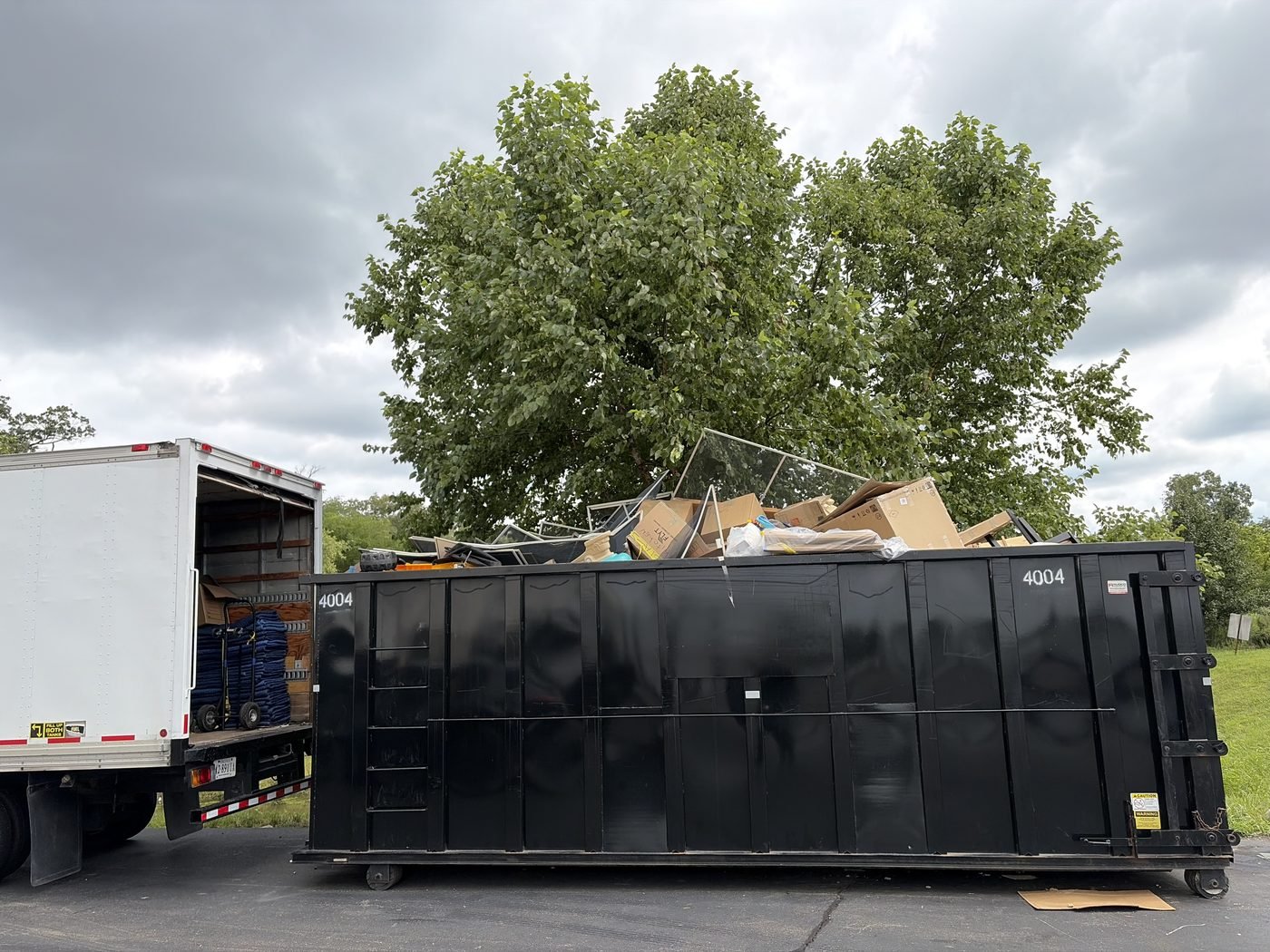 Full roll-off dumpster loaded with junk by The Junk Boss during a whole-house cleanout in Northern Virginia