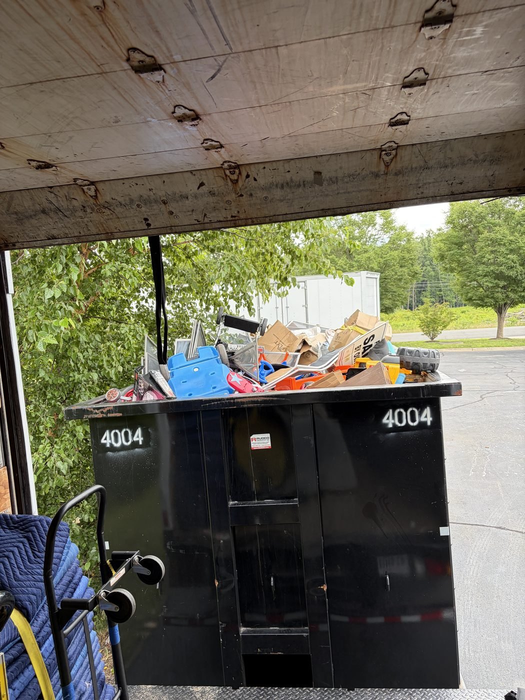 The Junk Boss truck loaded with furniture, boxes and household junk during a same-day pickup in Northern Virginia
